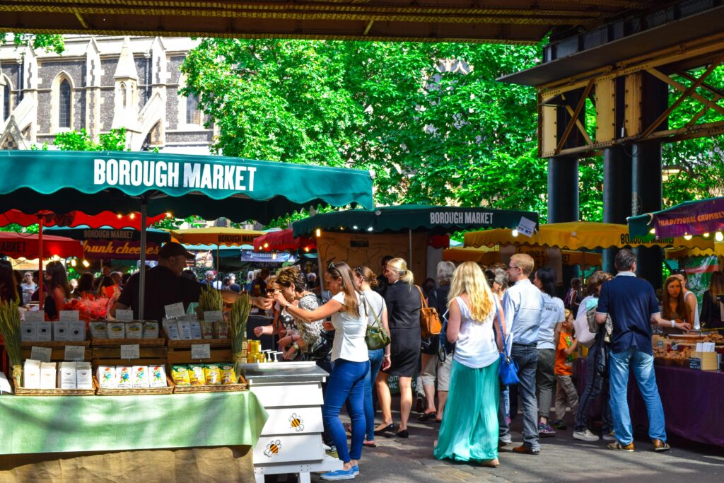 pexels-photo-439818-439818 Lively scene at Borough Market in London, filled with people shopping and enjoying the atmosphere.